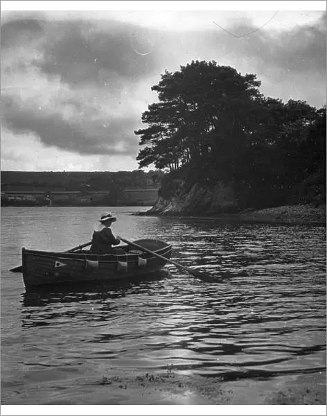 Veronica (Major Gills wife) rowing in a creek off the River Fal, Cornwall. Around 1925