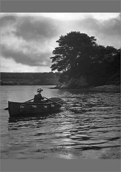 Veronica (Major Gills wife) rowing in a creek off the River Fal, Cornwall. Around 1925