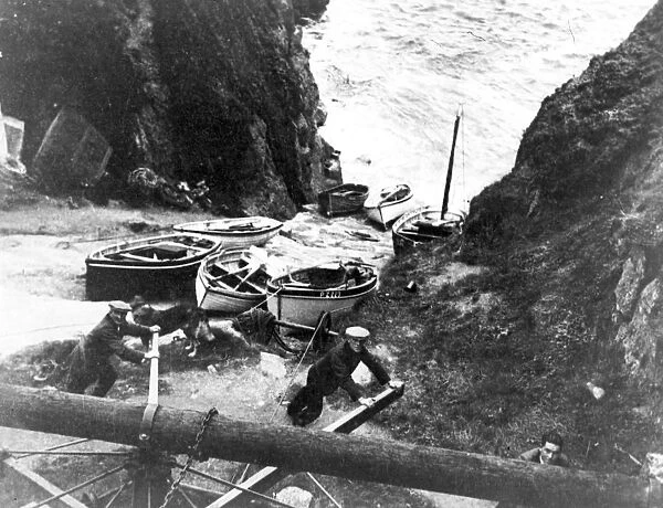 Hauling boats up the slipway using the old capstan, Porthgwarra, Cornwall. Early 1900s