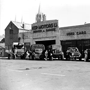 British Army service vehicles outside H. T. P. Motors Ltd. Back Quay, Truro, Cornwall. Around 1944