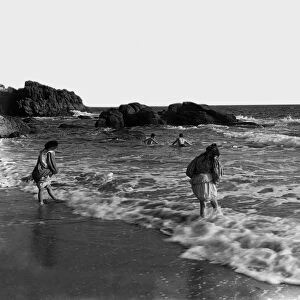 Children paddling at Rinsey, Breage, Cornwall. Early 1900s