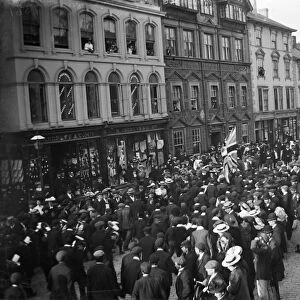 Crowd watching a parade in Boscawen Street, Truro, Cornwall. Possibly 27th May 1913