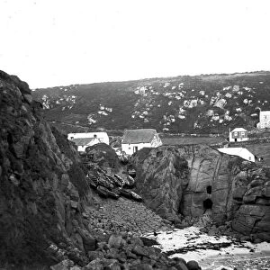 View from the cliff over the slipway and cottages behind, Porthgwarra, Cornwall. Early 1900s