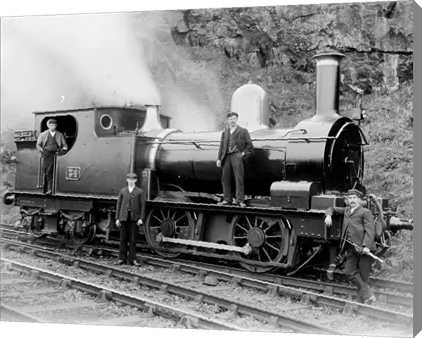 GWR tank number 34 pictured with four men on the St Ives branch. Around 1905