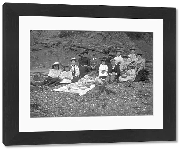 A picnic party below cliff, Padstow, Cornwall. Probably 1890s or early 1900s
