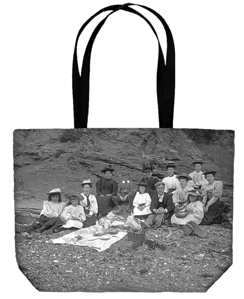 A picnic party below cliff, Padstow, Cornwall. Probably 1890s or early 1900s