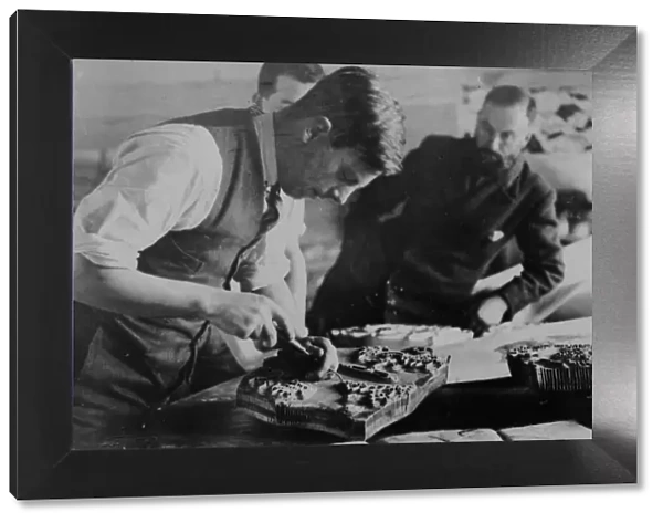 Carving a printing block at Crysede Island Works, St Ives, Cornwall. Probably 1930s