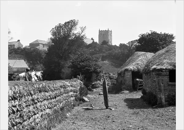 Distant view of St Merryn Church with horse and trap and figure from Treveglos, St Merryn, Cornwall. 1906