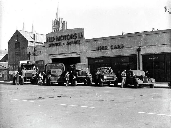 British Army service vehicles outside H. T. P. Motors Ltd. Back Quay, Truro, Cornwall. Around 1944