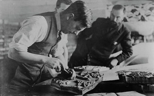 Carving a printing block at Crysede Island Works, St Ives, Cornwall. Probably 1930s
