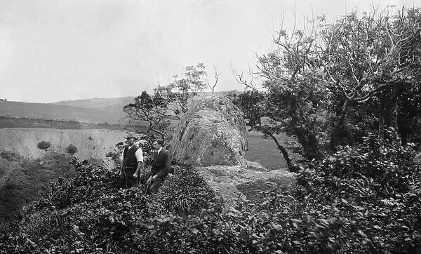 Charles Mannell and George Penrose admiring the view at Chapel Rock, Trenowth (near Grampound Road) in the parish of Probus, Cornwall. 17th June 1904