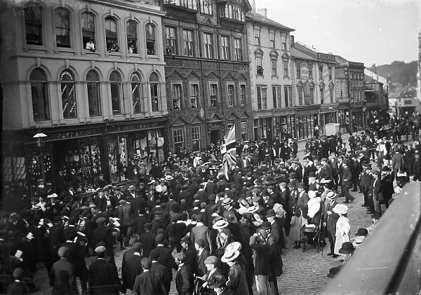 Crowd watching a parade in Boscawen Street, Truro, Cornwall. Possibly 27th May 1913