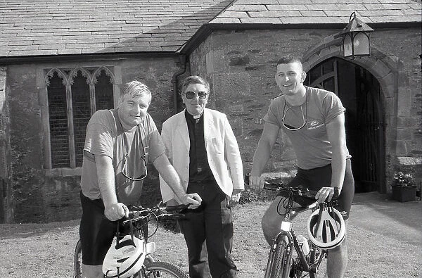 Cyclists at St Bartholomews Church, Lostwithiel, Cornwall. July 1993