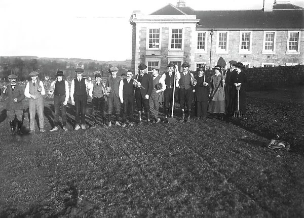 Digging over land outside Old County Hall, Truro, Cornwall for potato planting. January 1917