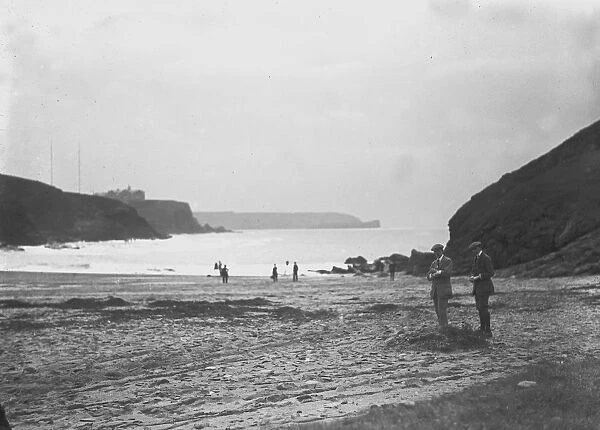 A distant view of two Marconi wireless towers and the Poldhu Hotel, Poldhu, Mullion, Cornwall. Probably 1920s