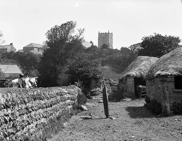 Distant view of St Merryn Church with horse and trap and figure from Treveglos, St Merryn, Cornwall. 1906