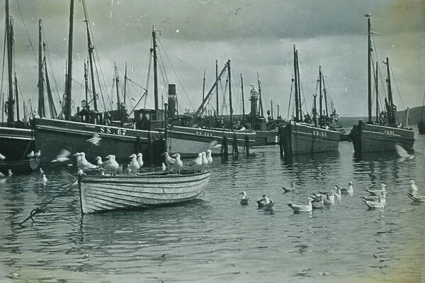 Fishing boats in harbour St Ives harbour, Cornwall. Around 1925