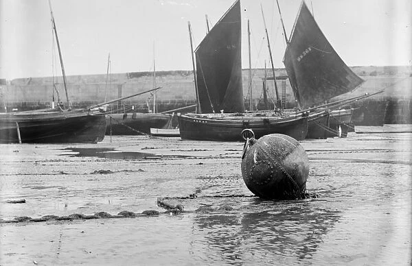 Fishing craft off Smeatons Pier at low tide. St Ives Harbour, Cornwall. Before 1900