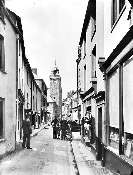 Fore Street, looking north towards the town hall clock tower, East Looe, Cornwall. 2nd June 1904