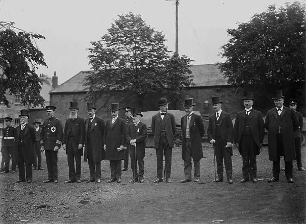 Gentlemen in top hats lined up on The Green, Truro, Cornwall. Early 1900s