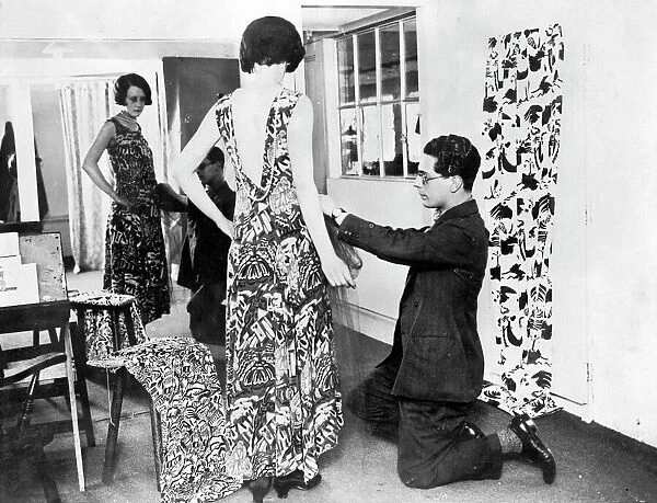 George Criscuolo fitting an evening gown of Crysede silk, St Ives, Cornwall. Around 1927