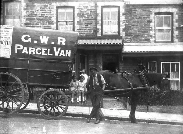 Great Western Railway horse-drawn parcel van outside the terraced house Fern Dale, Newquay, Cornwall. Probably 1932