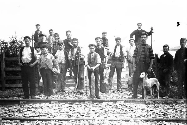 Group of men and boys on a railway track, possibly Padstow-Wadebridge branch line, Cornwall. Early 1900s