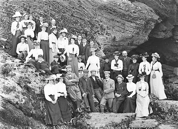 A group posed by the rocks at Godrevy, Gwithian, Cornwall. Early 1900s