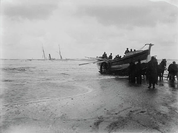 The Hayle lifeboat New Oriental Bank (later renamed E. F. Harrison) with the wreck of the SS Escurial in the background, Portreath, Cornwall. 25th January 1895