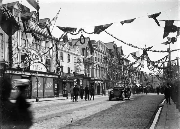 A highly decorated Boscawen Street looking east, Truro, Cornwall. Thought to be 27th May 1913 but possibly earlier