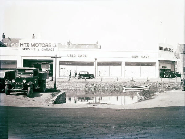 H.T.P. Motors Ltd, Back Quay, Truro, Cornwall. Taken before the the last section of the river was covered over in 1938