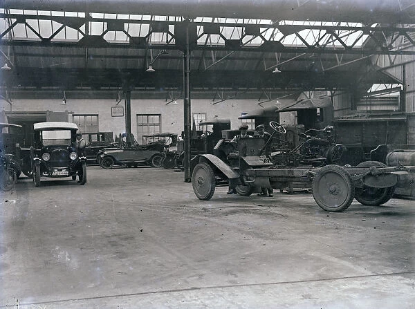 Interior of Princes Garage with vehicles and workers, H. T. P. Motors Ltd, Truro, Cornwall. Early 1920s