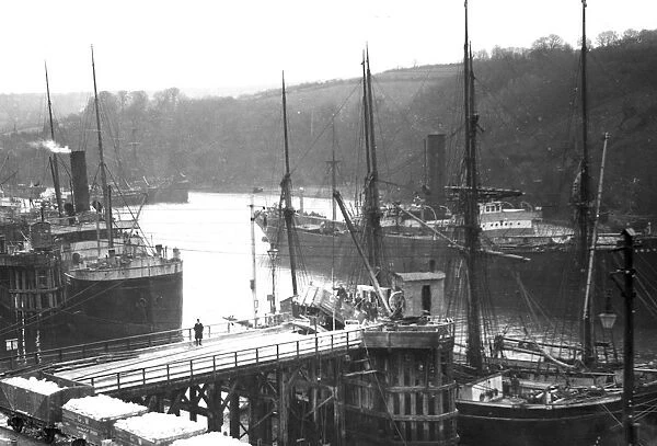 Loading clay into a schooner at Fowey Harbour, Cornwall. Early 1900s