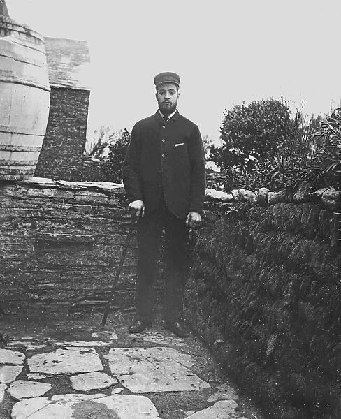 A man posed in a back garden in or near Padstow, Cornwall. Probably 1890s or early 1900s