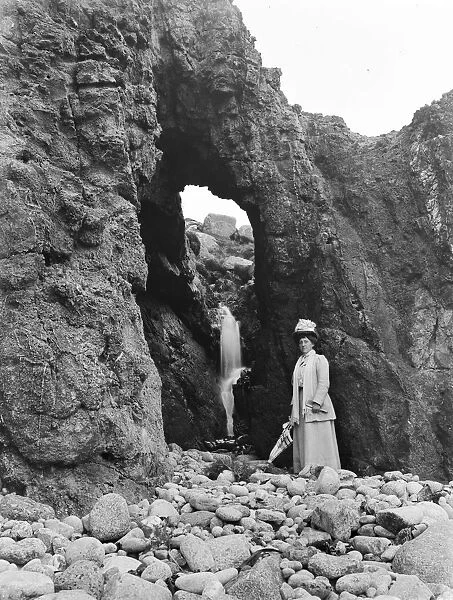 A natural arch in the rocks at Nanjizal, St Levan, Cornwall. 1907
