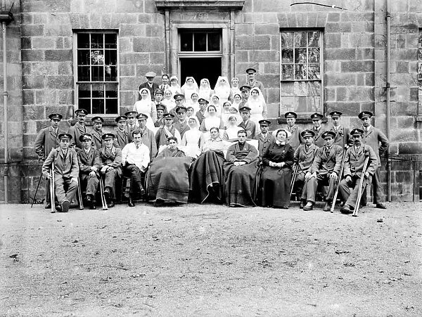 Patients and nurses outside the Royal Cornwall Infirmary, Truro, Cornwall. Probably 1916