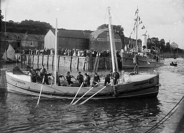 RNLI Padstow Lifeboat No. 2 Edmund Harvey with the tug Helen Peele alongside in the background, Padstow, Cornwall. 1901