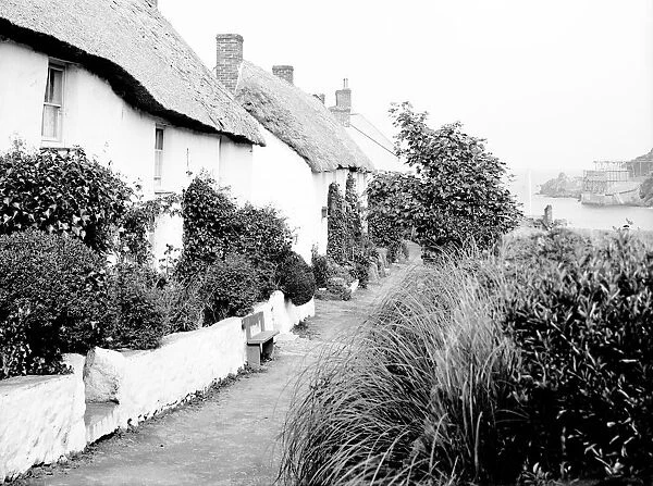 View along the row of cottages near the beach, Porthoustock, St Keverne, Cornwall. 1912