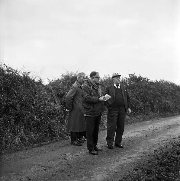 Visiting group near Giants Quoits after they fell, St Keverne, Cornwall. 9th January 1966