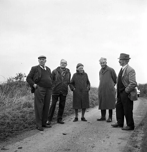 Visiting group near Giants Quoits after they fell, St Keverne, Cornwall. 9th January 1966