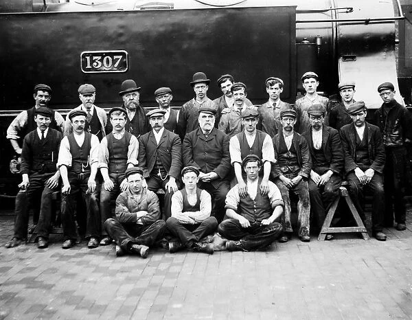 Workers in front of locomotive GWR 1307. Possibly around 1895