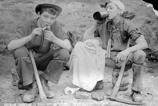 Two young miners at croust time at an unidentified mine in Cornwall. Late 1800s