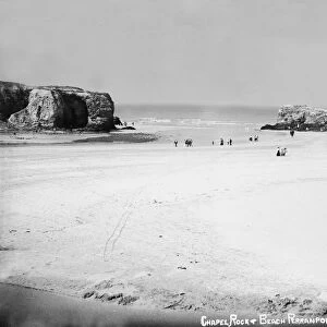 Beach with distant view of Arch Rock and Chapel Rock, Perranporth, Perranzabuloe, Cornwall. Early 1900s
