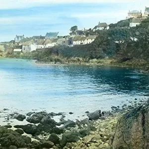 Coverack from across the beach at high tide, Cornwall. Around 1925