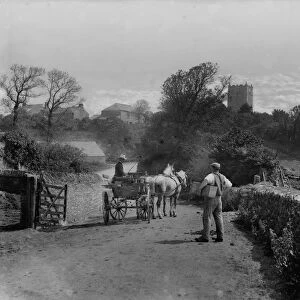 Distant view of St Merryn Church with horse and trap and figures in foreground from Treveglos, St Merryn, Cornwall. 1906