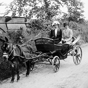 Donkey cart with two women, Cornwall. 1910