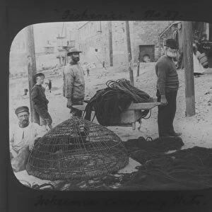 Fishermen carrying nets at St Ives, Cornwall County Fisheries Exhibition, Truro, Cornwall. July to August 1893