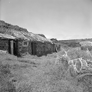 Fishermens huts and lobster pots, Prussia Cove, St Hilary, Cornwall. 1970