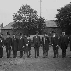 Gentlemen in top hats lined up on The Green, Truro, Cornwall. Early 1900s
