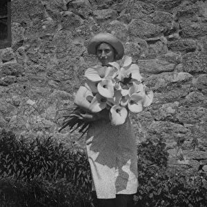 Girl with Arum lilies, Bryher, Isles of Scilly, Cornwall. 1910s